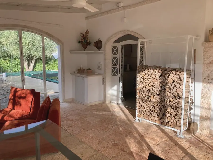 The veranda with the log store and the windows onto the garden