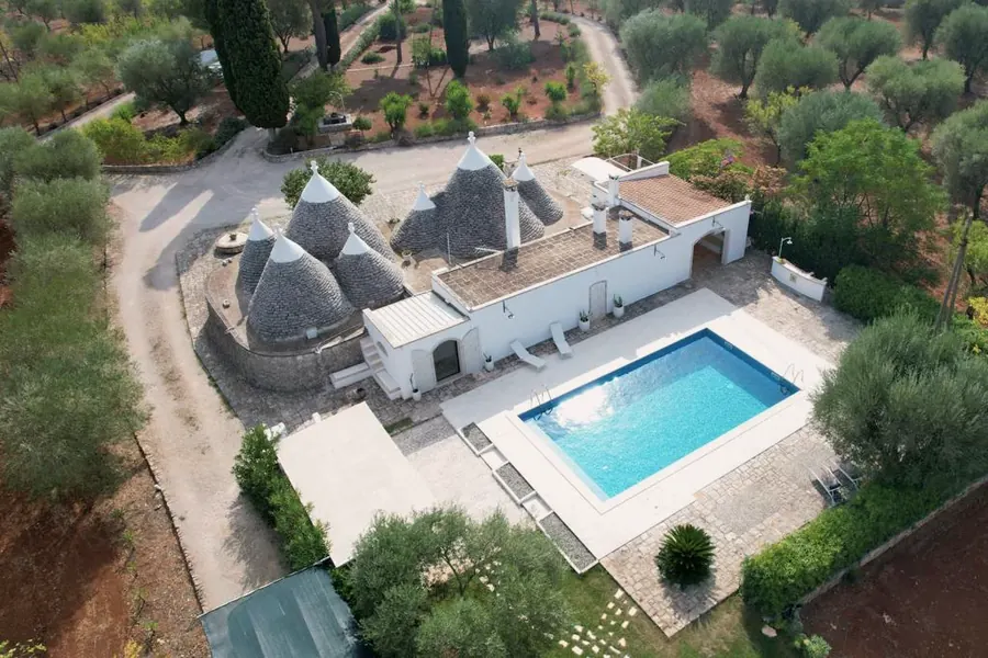 Trullux from above: the trulli, the pool and the olive trees